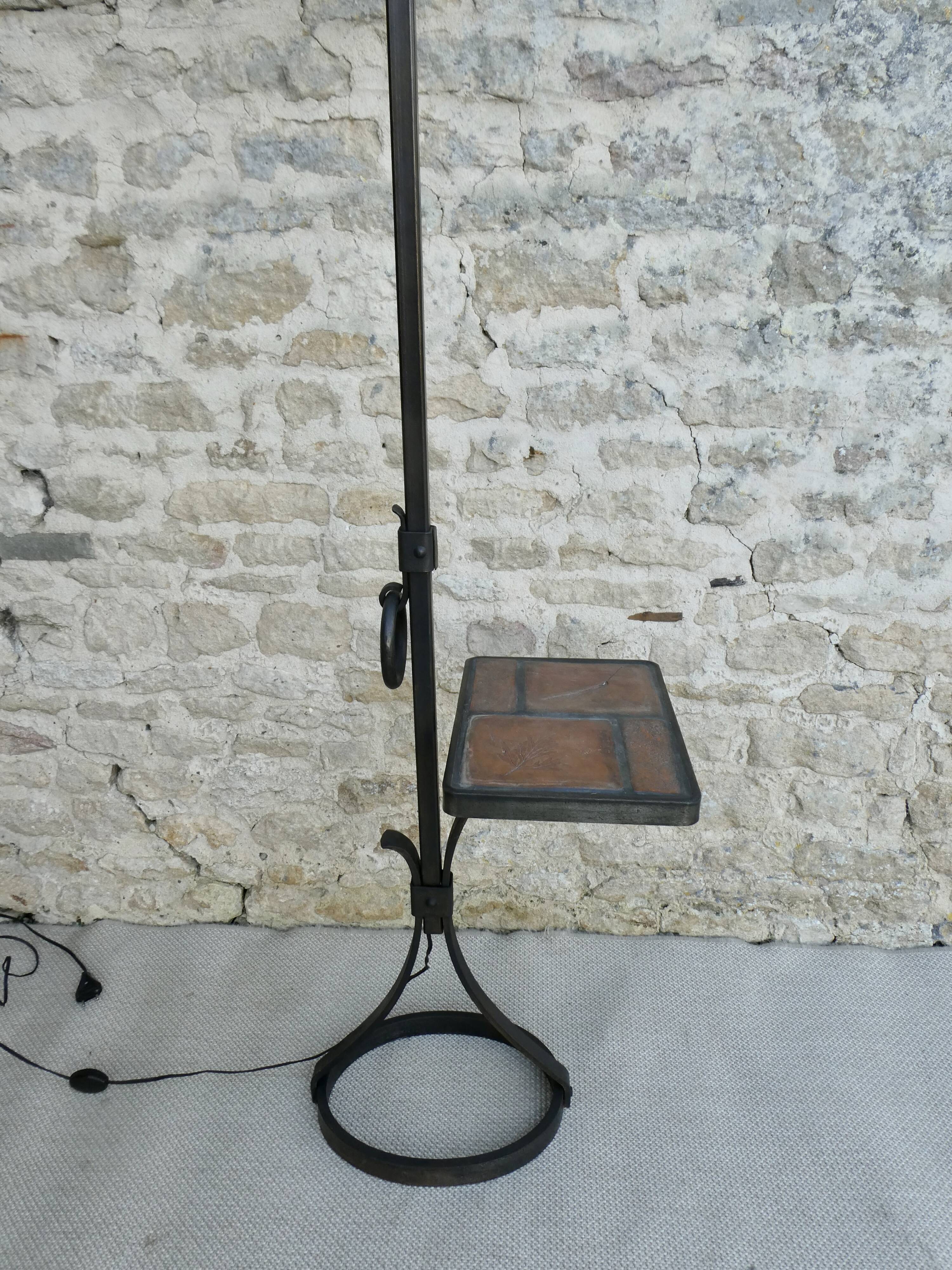 Wrought iron floor lamp with ceramic shelf herbarium decoration