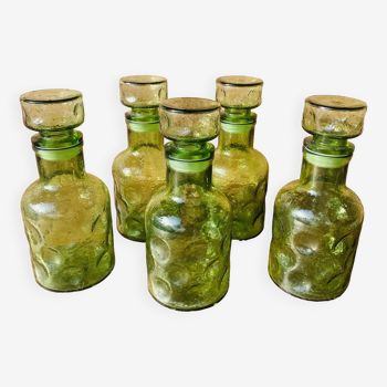 Set of 5 70s green bubbled glass carafes.