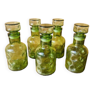 Set of 5 70s green bubbled glass carafes.