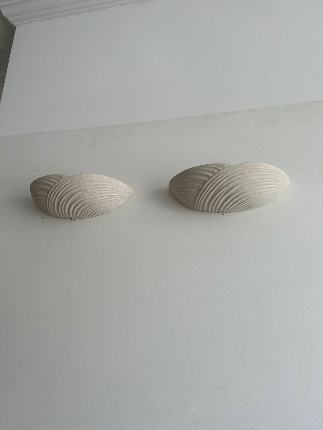 Pair of wall lamps in molded plaster France 1980