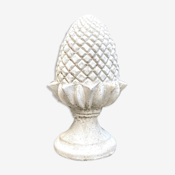Ornamental pine cone in bleached concrete