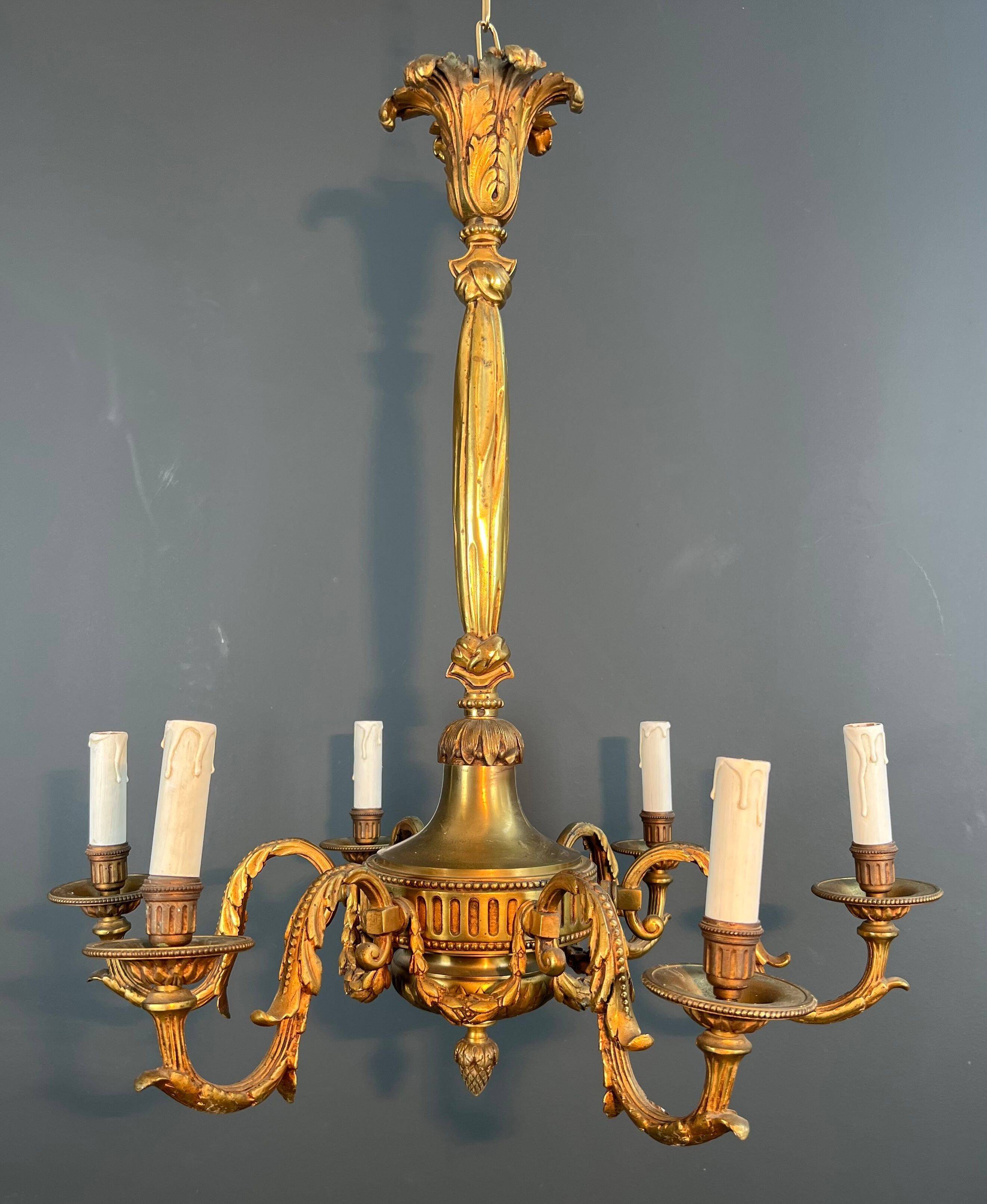 Lustre with 6 light arms in bronze in the Louis XVI style.