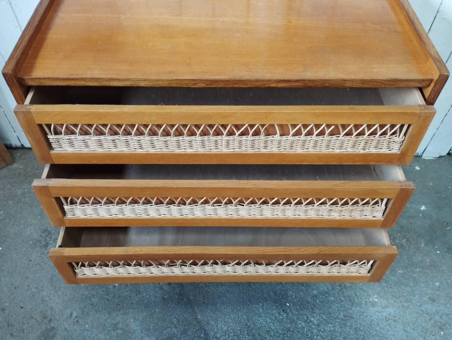 Vintage rattan chest of drawers with compass feet