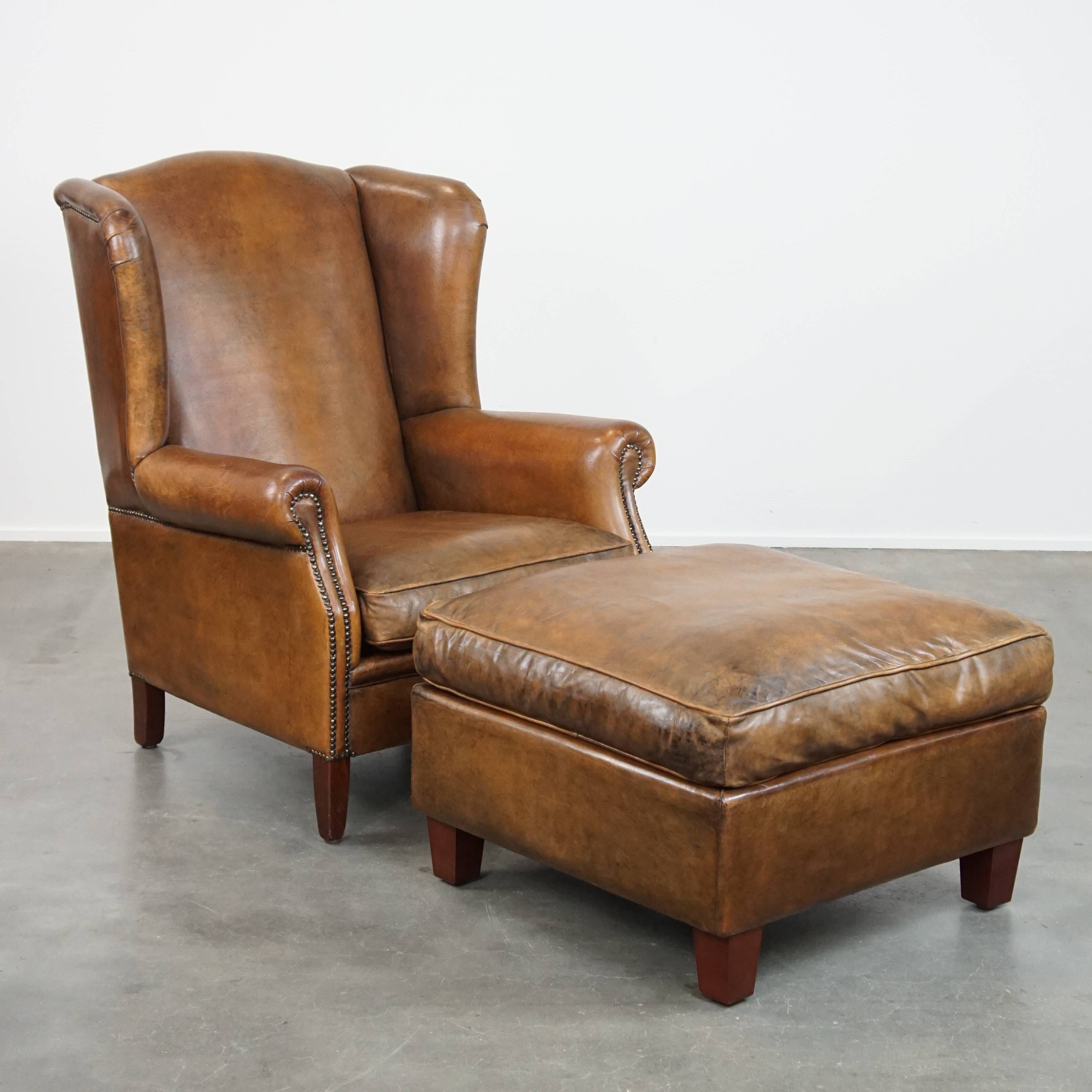 Sheepskin wing chair + XXL patinated footrest