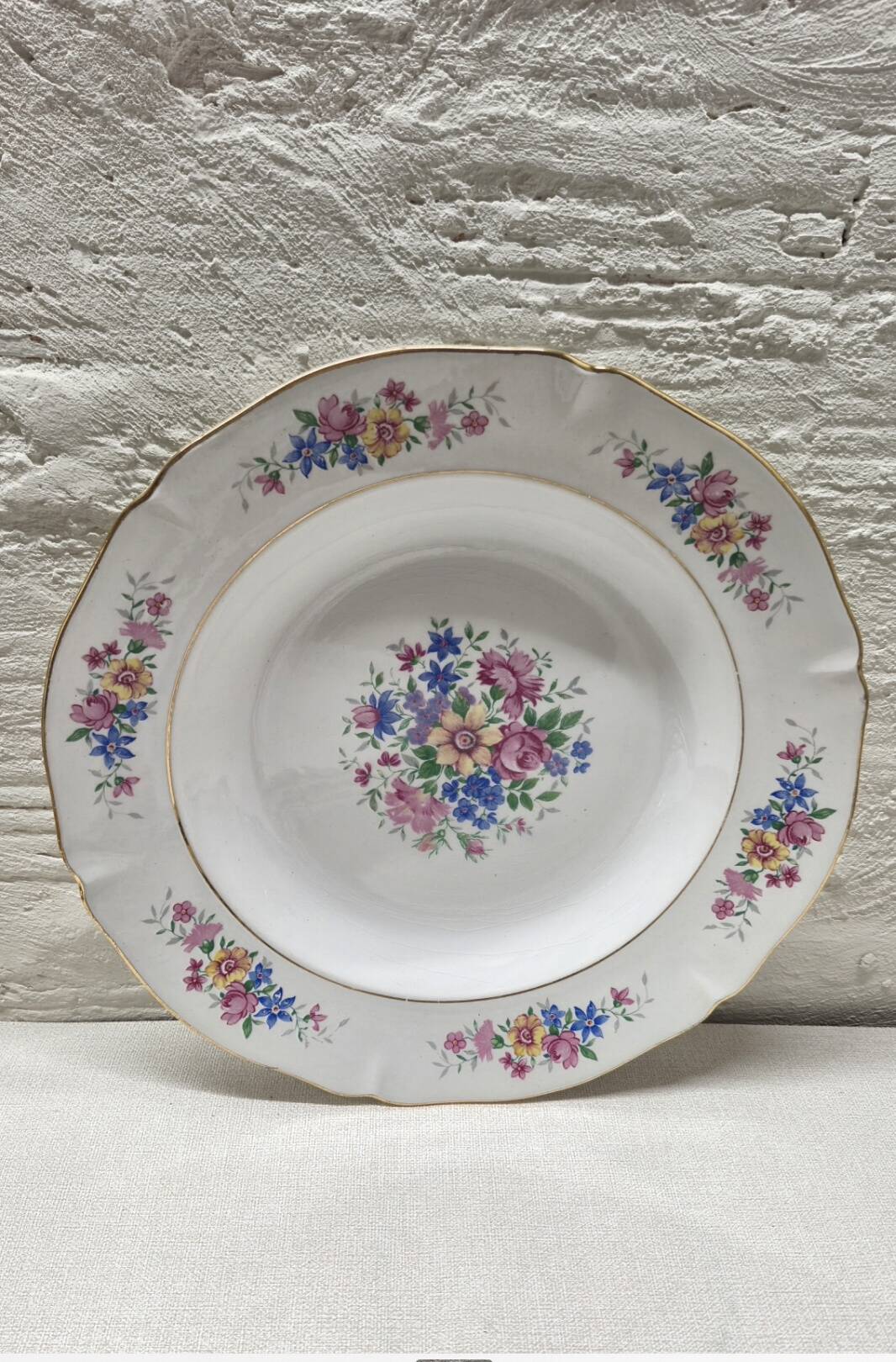 Set of 5 small flowered deep plates.