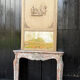 Directoire mirror or overmantel, stuccoed and painted wood, early 19th century.