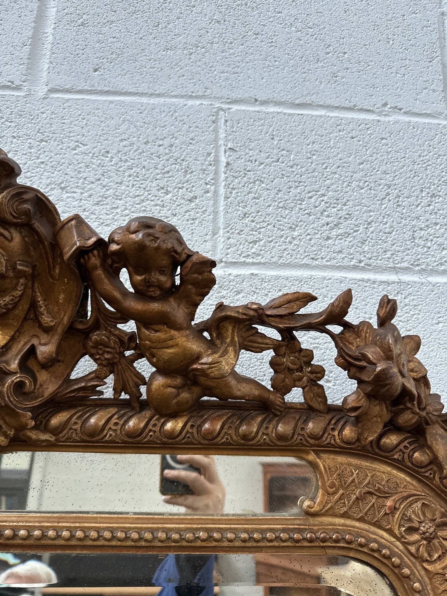 19th century mirror with cherubs