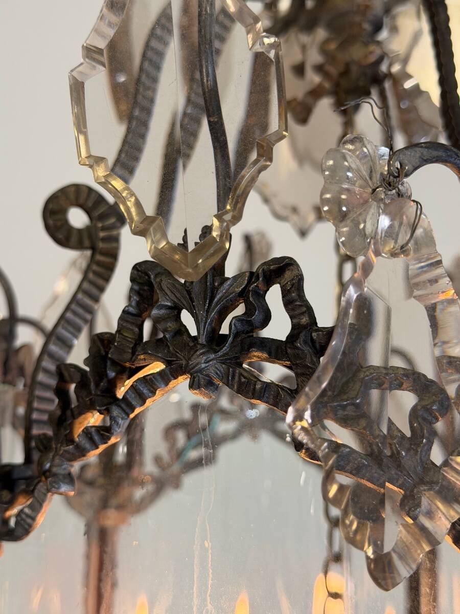 Louis XV style lantern in blackened brass adorned with cut crystal pendants, circa 1900.
