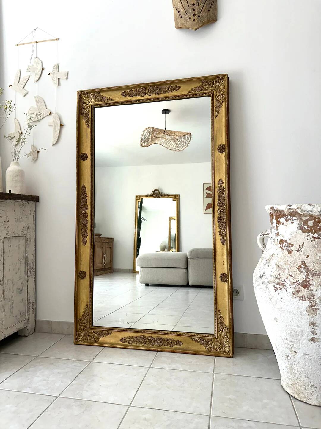 Antique gilded mirror from the Restoration period, 19th century.