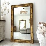 Antique gilded mirror from the Restoration period, 19th century.
