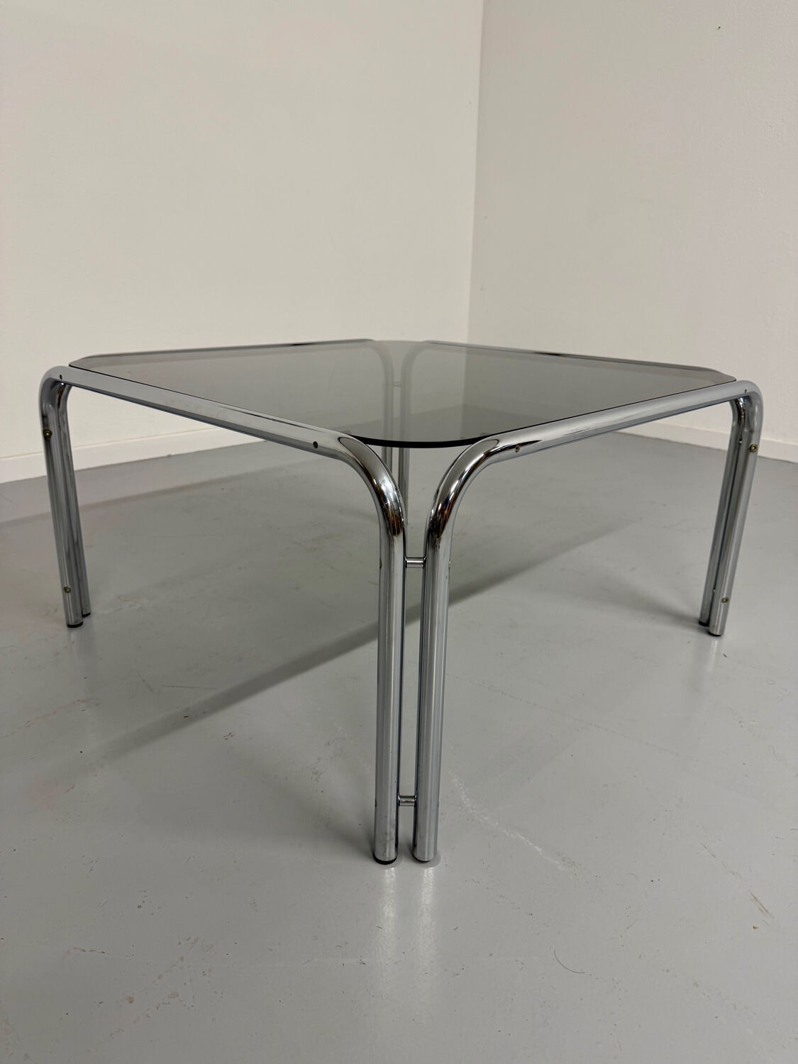 Space coffee table from the 70s, tubular metal and vintage smoked glass