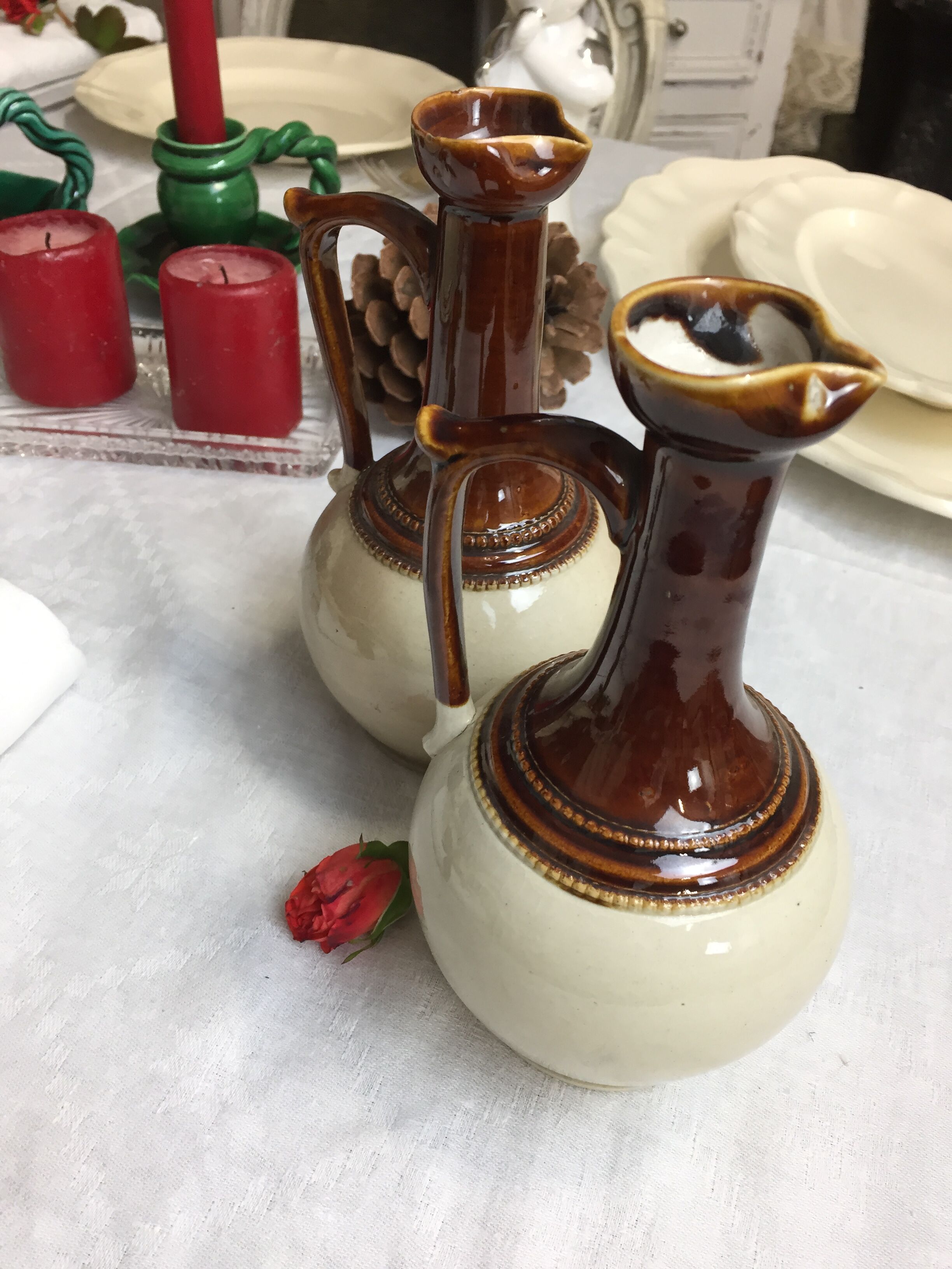 Antique handmade pitchers in beige and brown enamelled terracotta