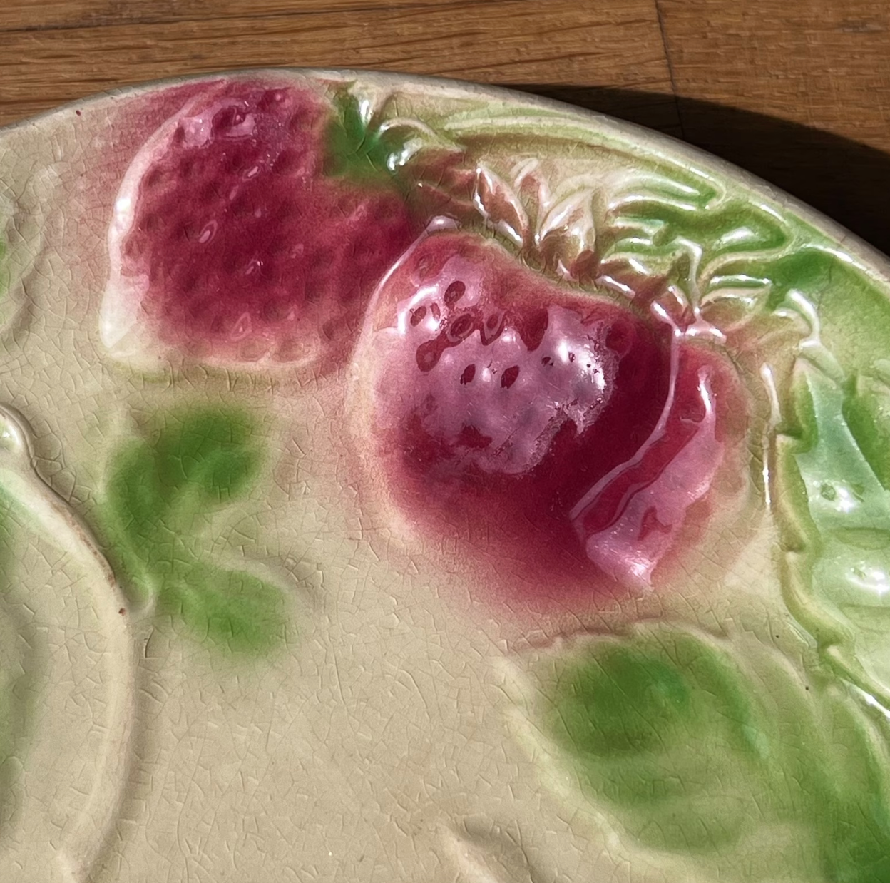 Plate in slip decoration strawberries and leaves