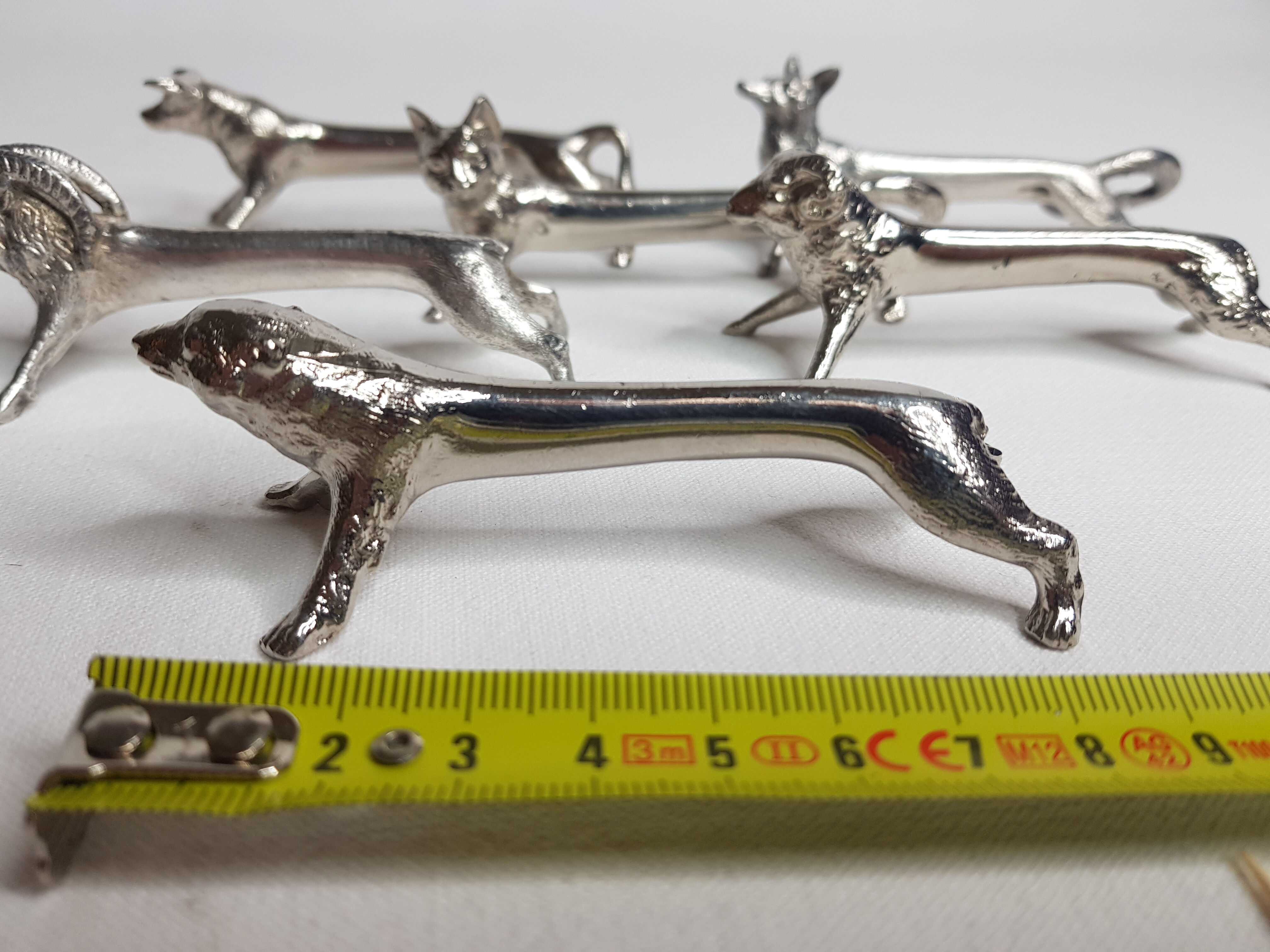 Six old animal knife holders in chrome metal