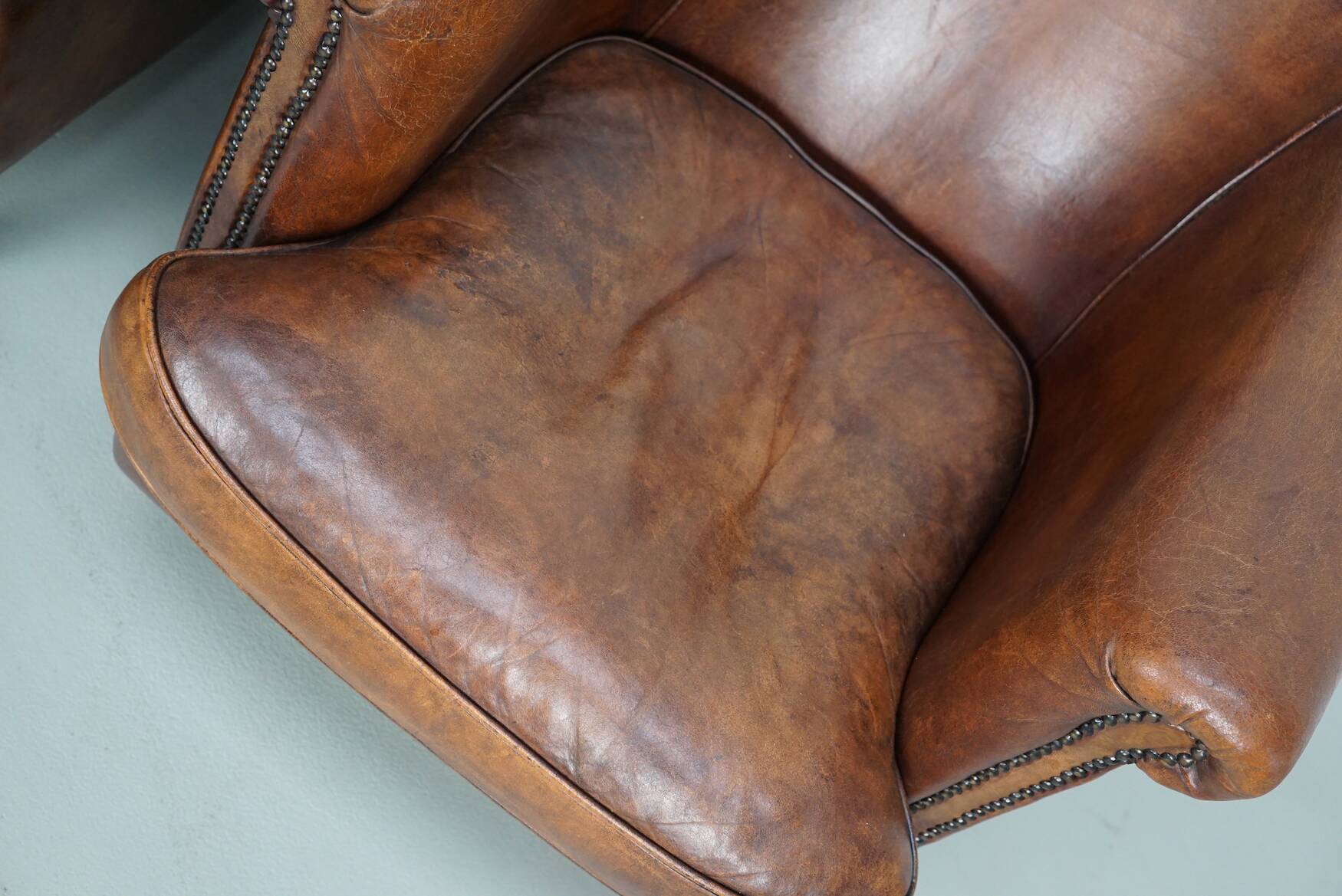 Vintage Dutch cognac coloured leather club chair, set of 2 with footstool