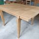 Oak dining table with a checkerboard top and extensions.
