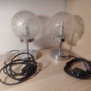 Duo of textured globe lamps with a large play of light.
