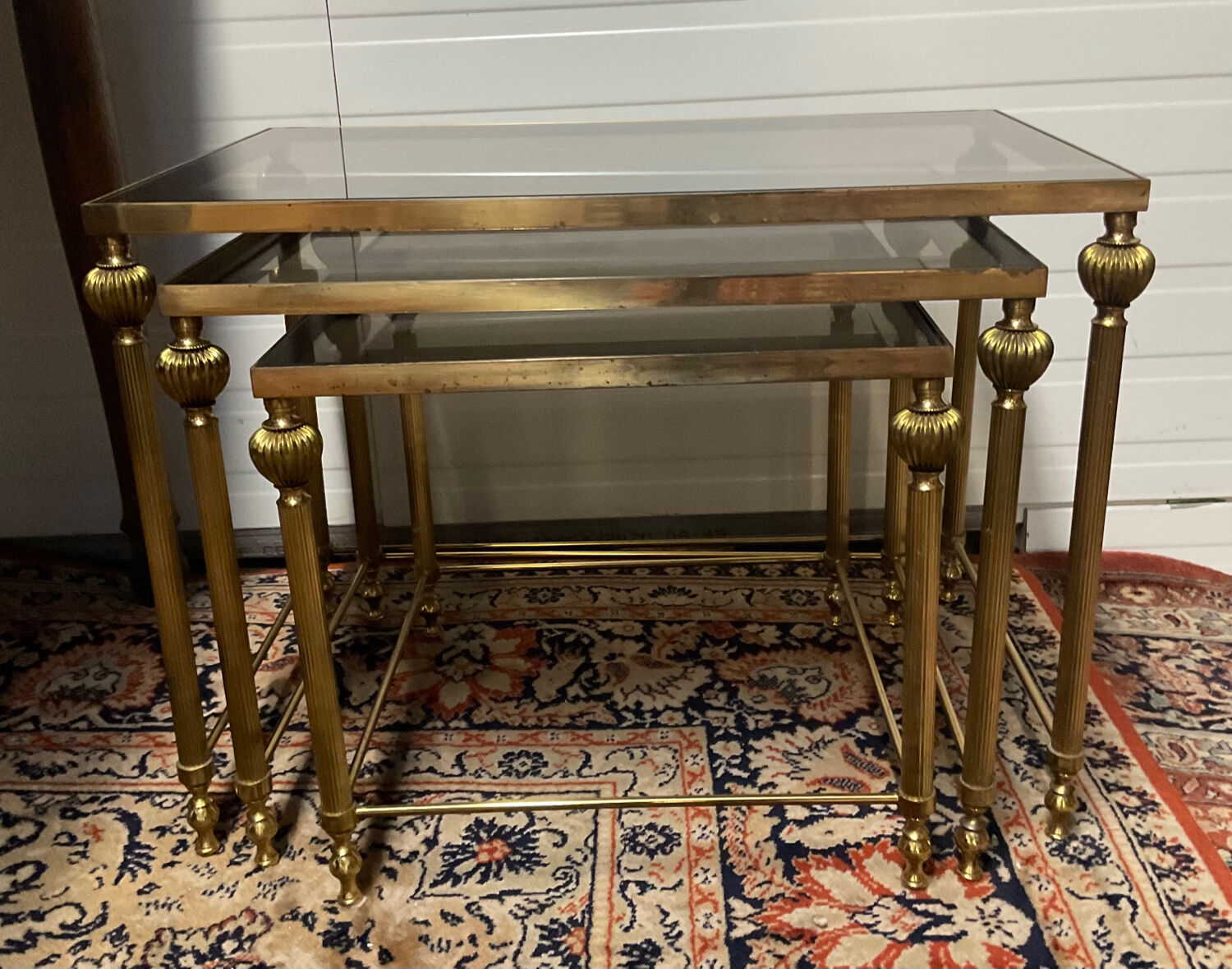 Series of 3 empire style nesting tables in brass and glass
