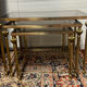 Series of 3 empire style nesting tables in brass and glass