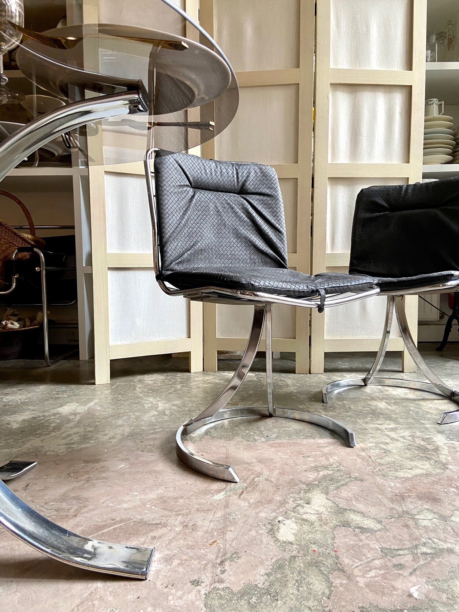 2 chairs in chromed metal and black woven skaï 1970s