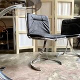 2 chairs in chromed metal and black woven skaï 1970s