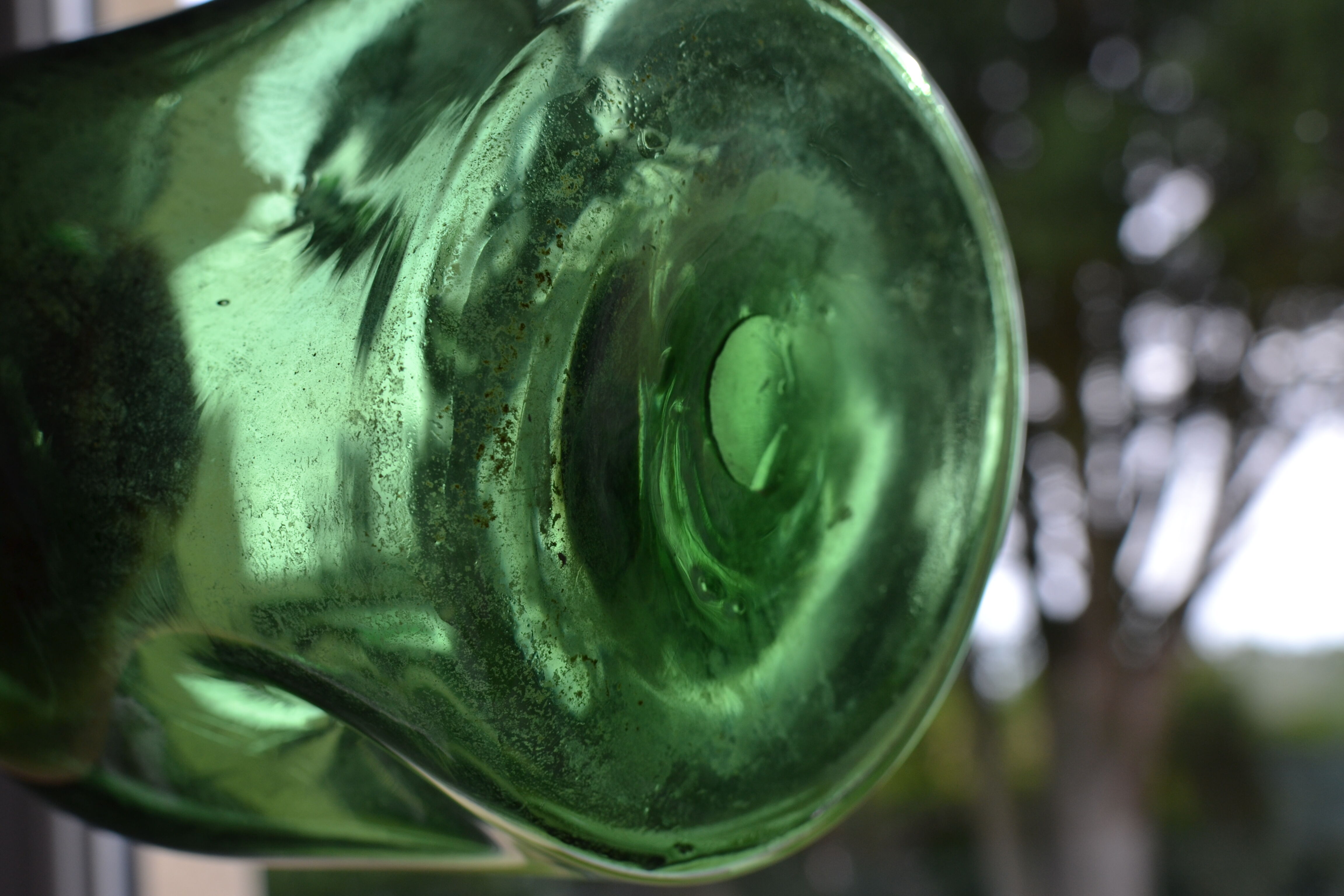 Dented green bottle