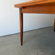 Rectangular extendable dining table with Scandinavian design in teak.