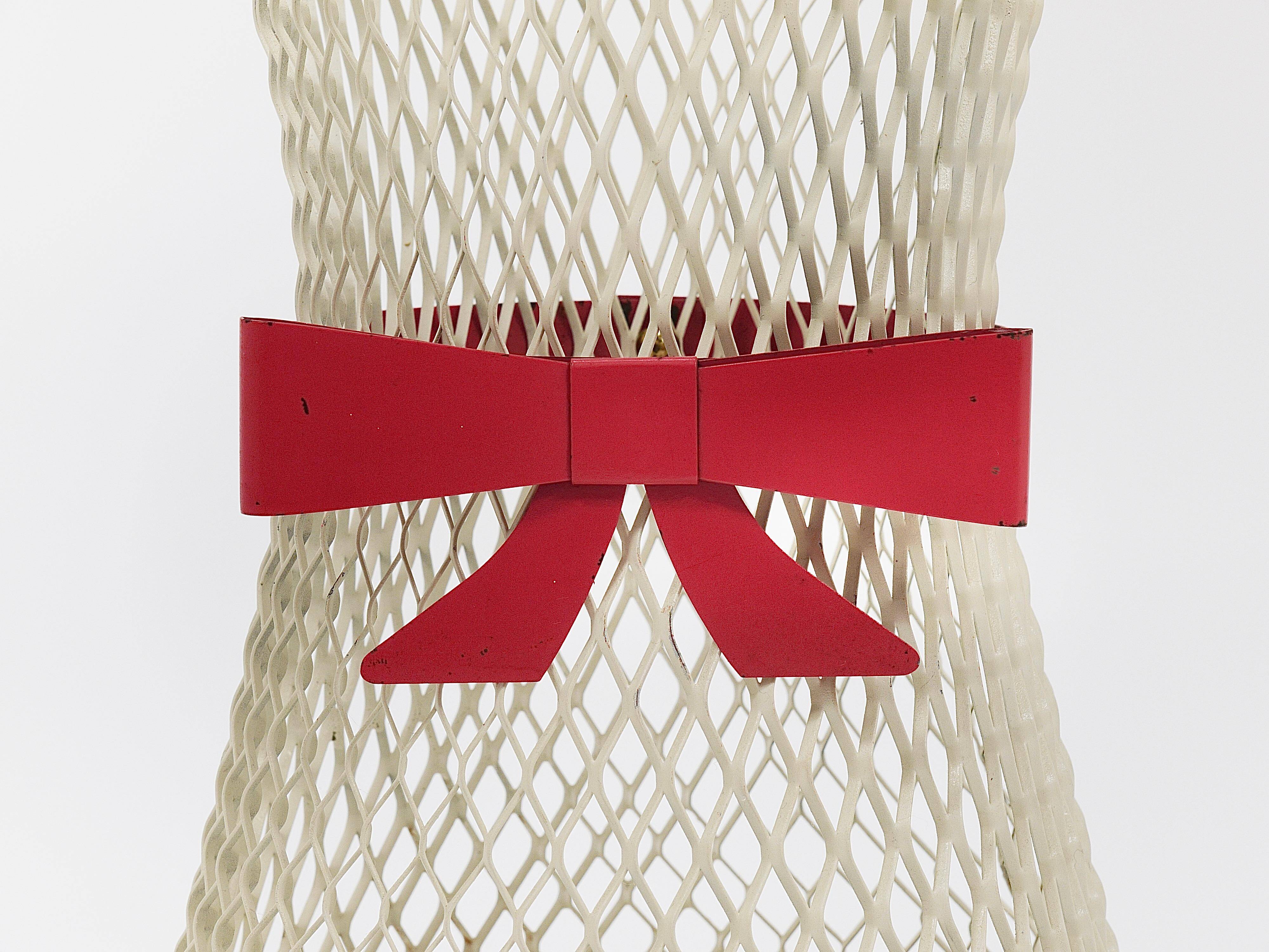 Bow tie umbrella stand in the style of Mathieu Matégot, mid-century, metal, France, 1950s.