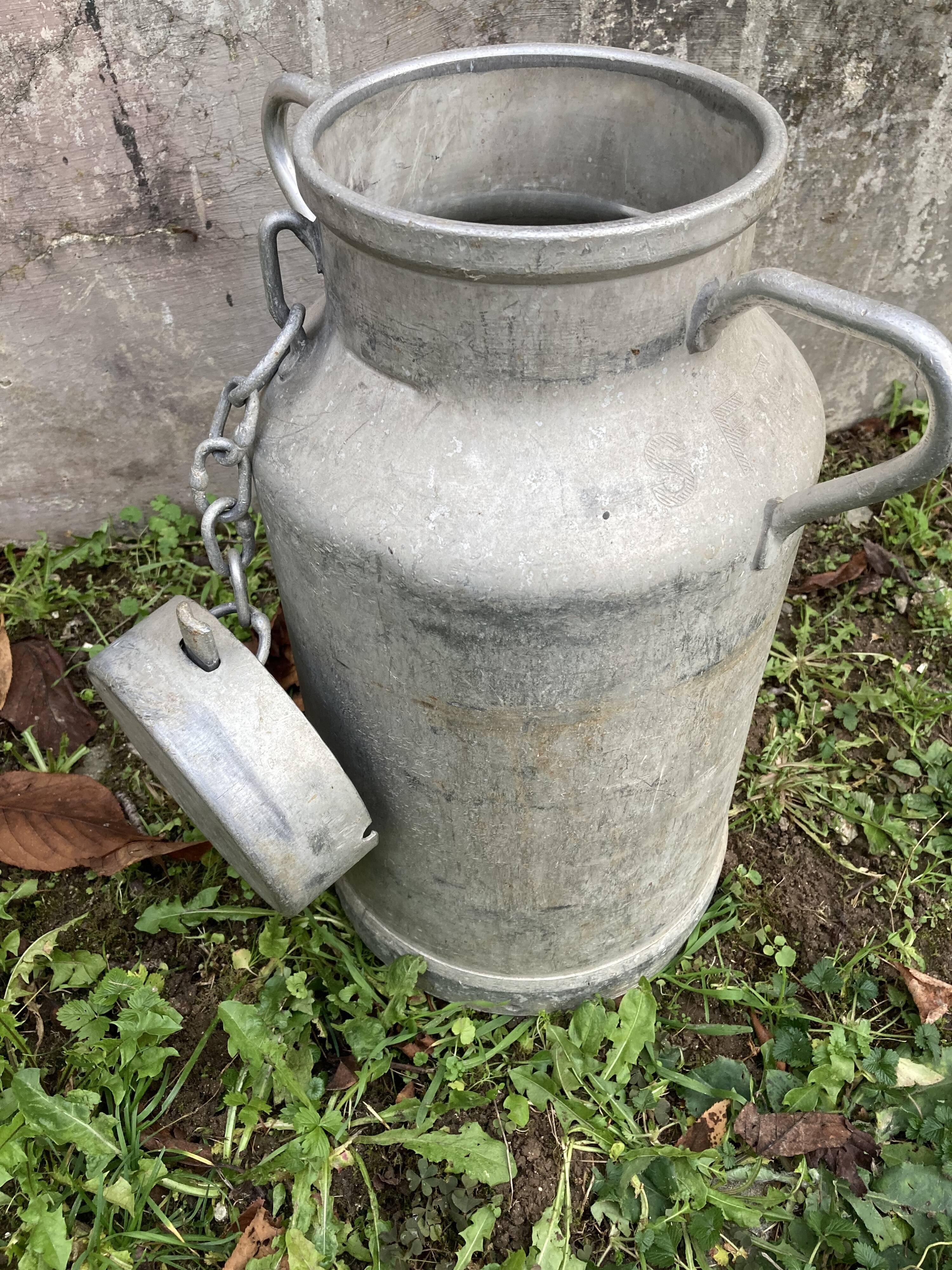 Pair of farm milk jars aluminum cans