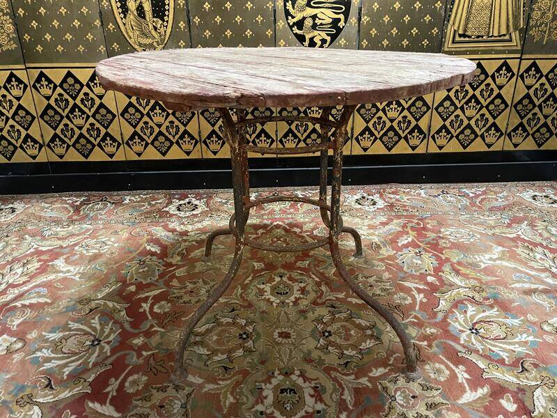 Wrought iron garden table with round top