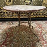 Wrought iron garden table with round top