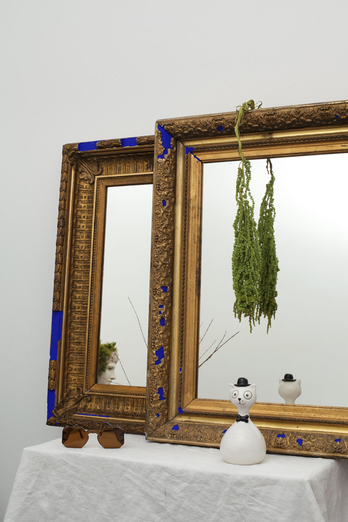 Golden antique mirror with leaf and bright king blue