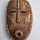 Decorative African mask in carved wood and cowrie shells, Baoulé style, 34 cm