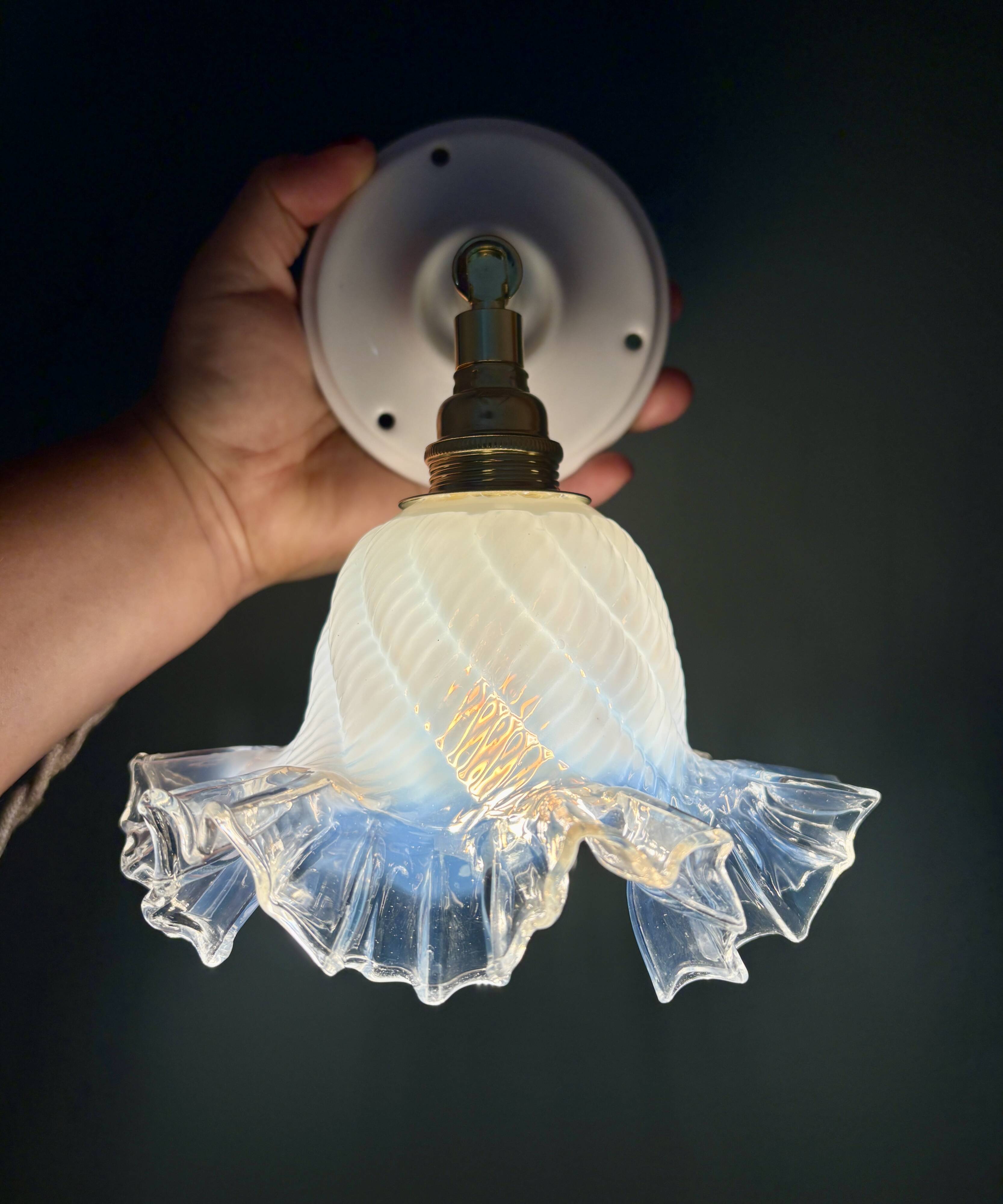 Vintage tulip glass wall light in transparent, slightly pearlescent white.