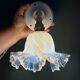 Vintage tulip glass wall light in transparent, slightly pearlescent white.