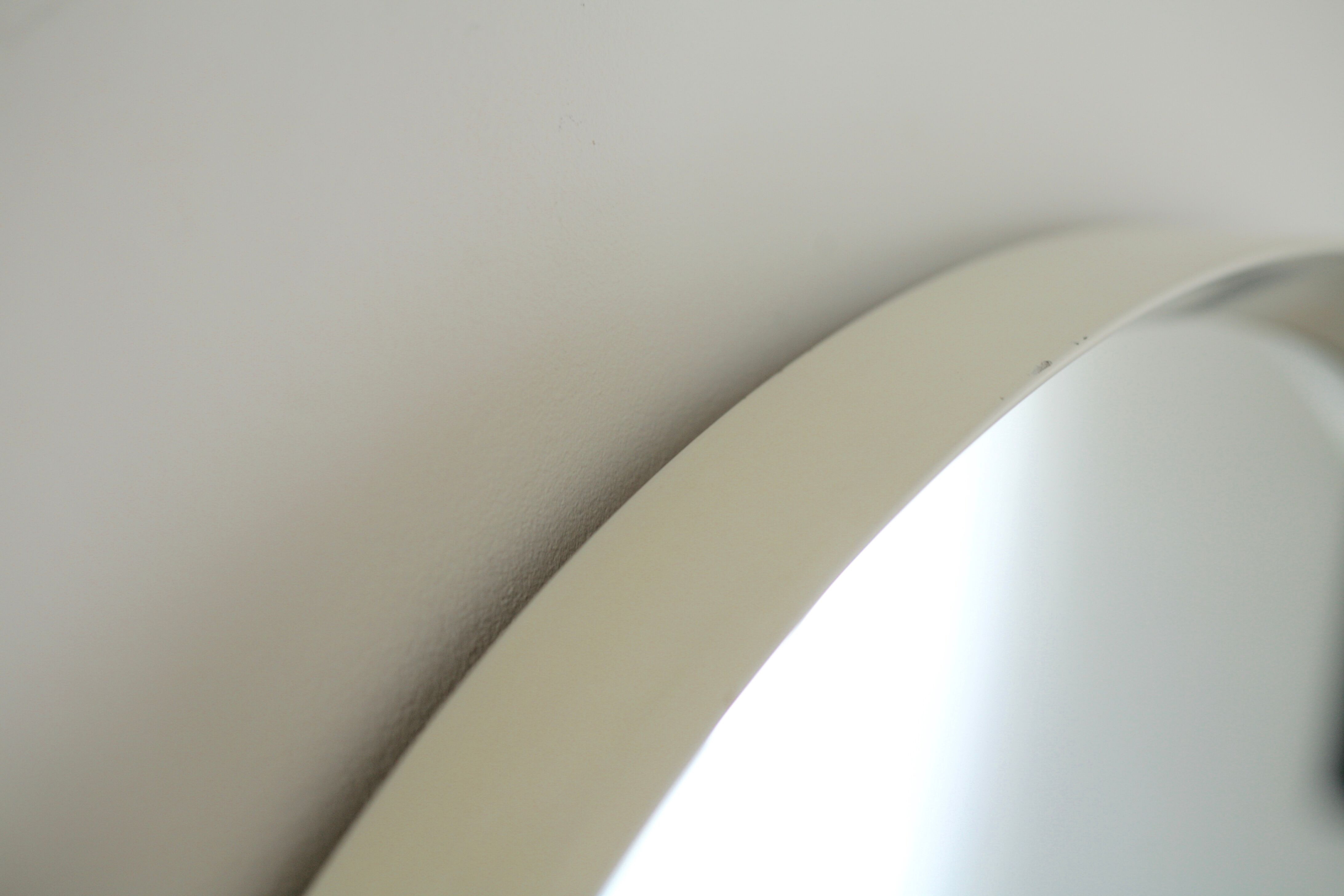 Circular mirror in "cream" laqué wood France circa 1960 68cm