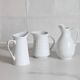 3 old French pitchers in white ceramic