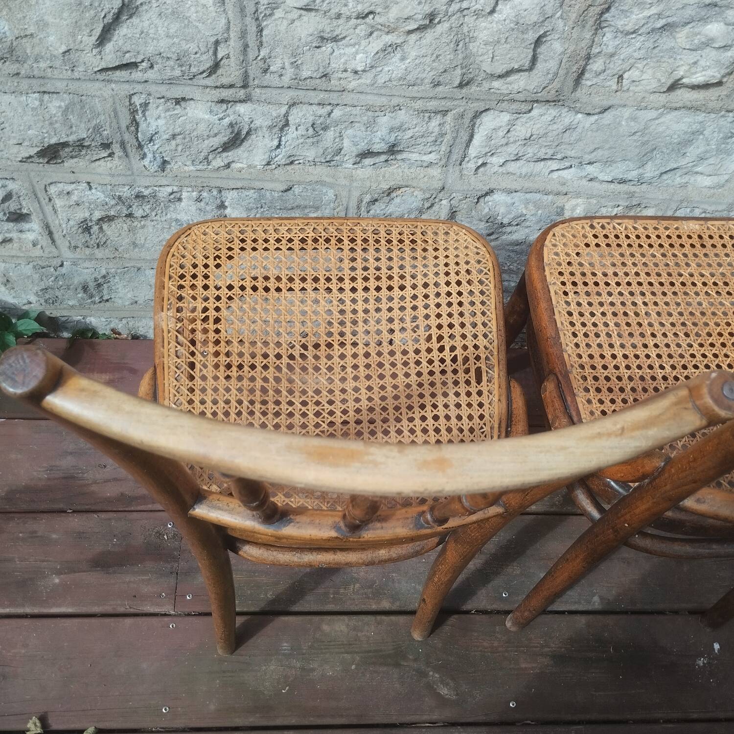 Set of 2 antique bistro chairs. Curved and turned wood.