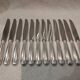 12 silver-plated table knives by Christofle Vendôme, 24.6cm