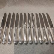 12 silver-plated table knives by Christofle Vendôme, 24.6cm