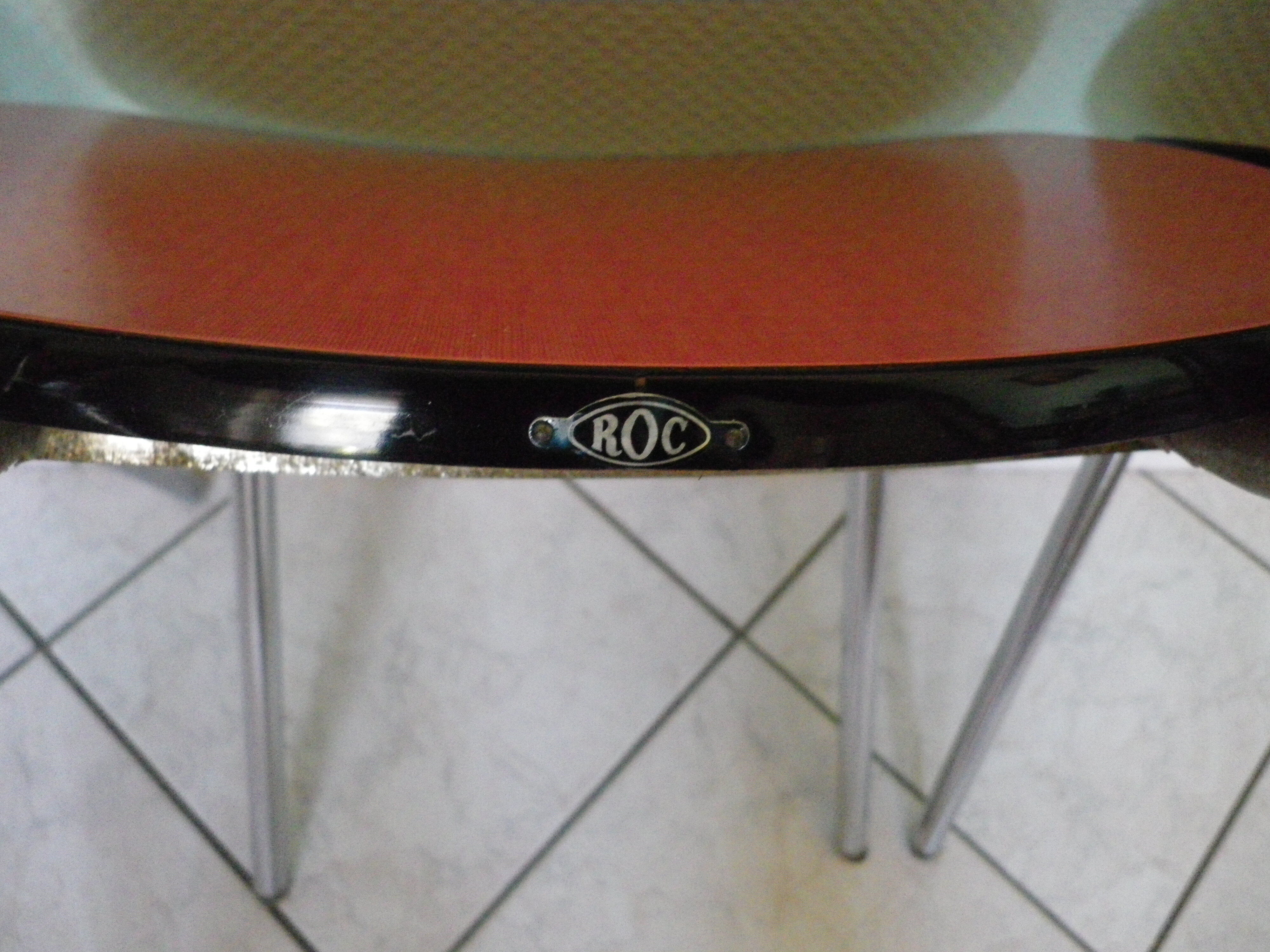 Table in red formica, 4 roc chairs, 2 extension cords, 2 drawers 60