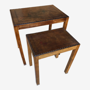 Pair of studded nesting tables and 1930