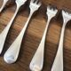 8 mismatched fish forks, silver metal