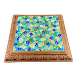 Longwy earthenware trivet on wooden mount, early 20th century