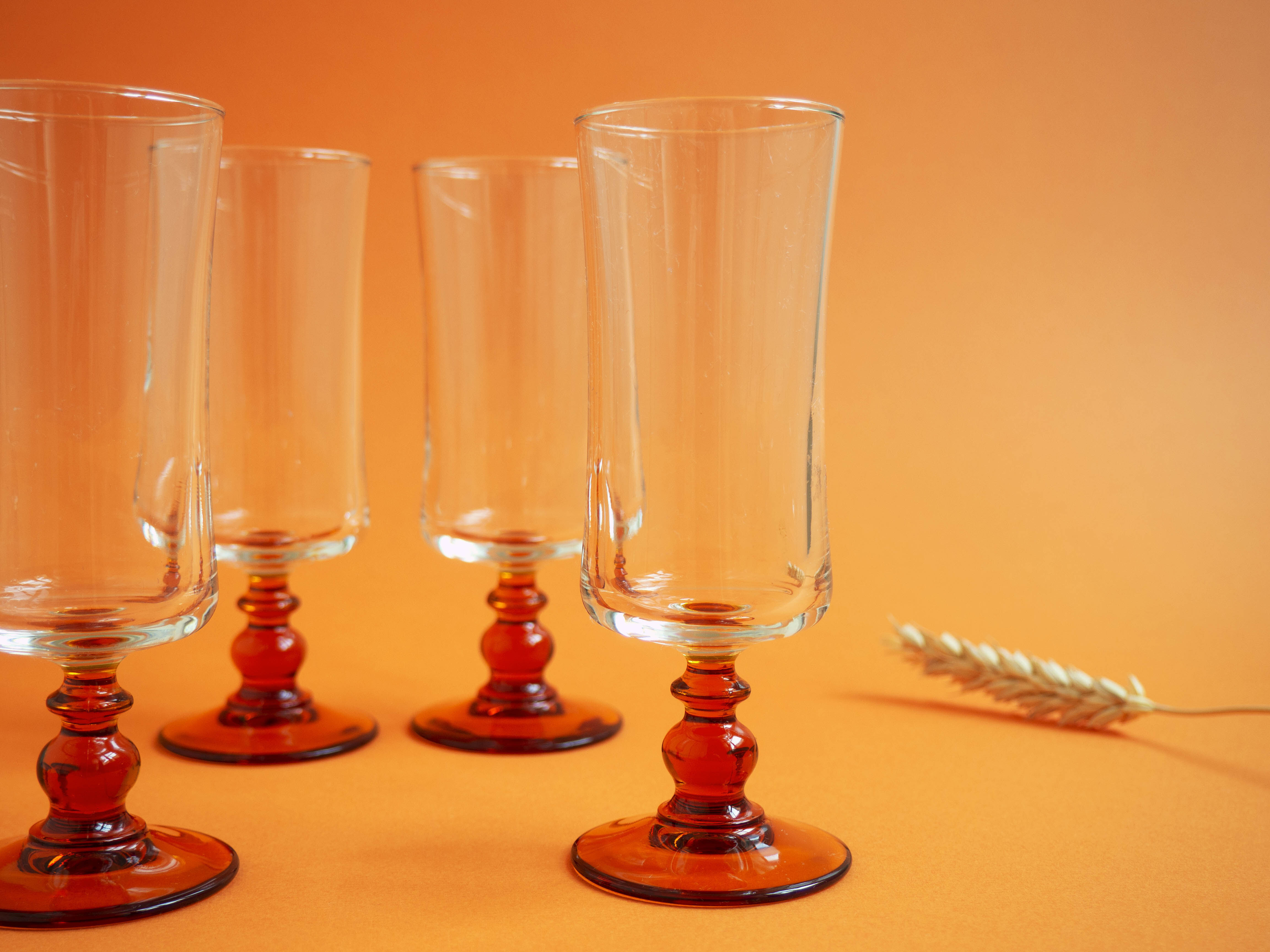 Glasses/flutes with a vintage orange foot