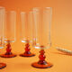 Glasses/flutes with a vintage orange foot