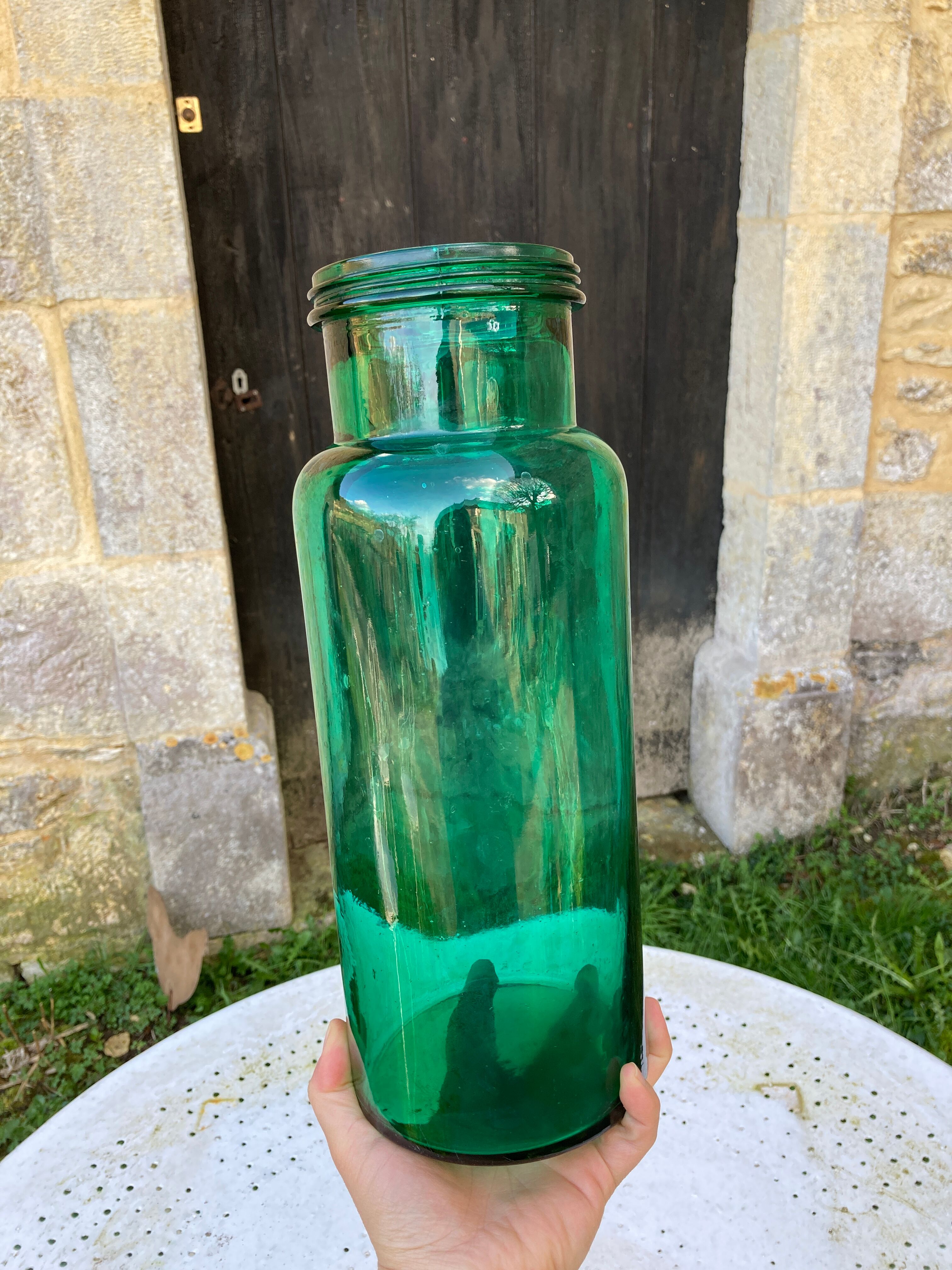 Large green glass jar