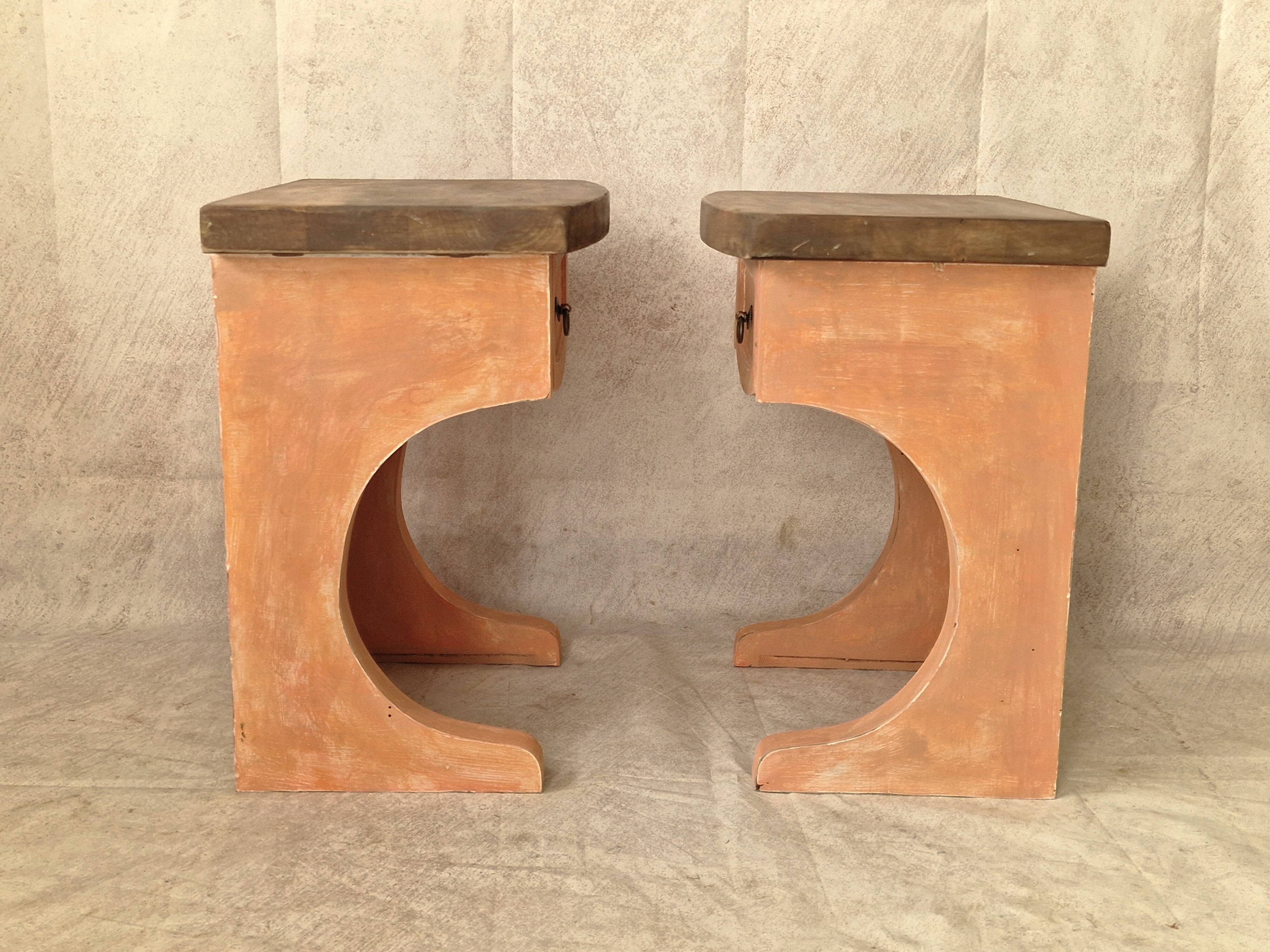 Pair of orange-pink patinated bedside tables