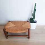 Low wooden stool and straw