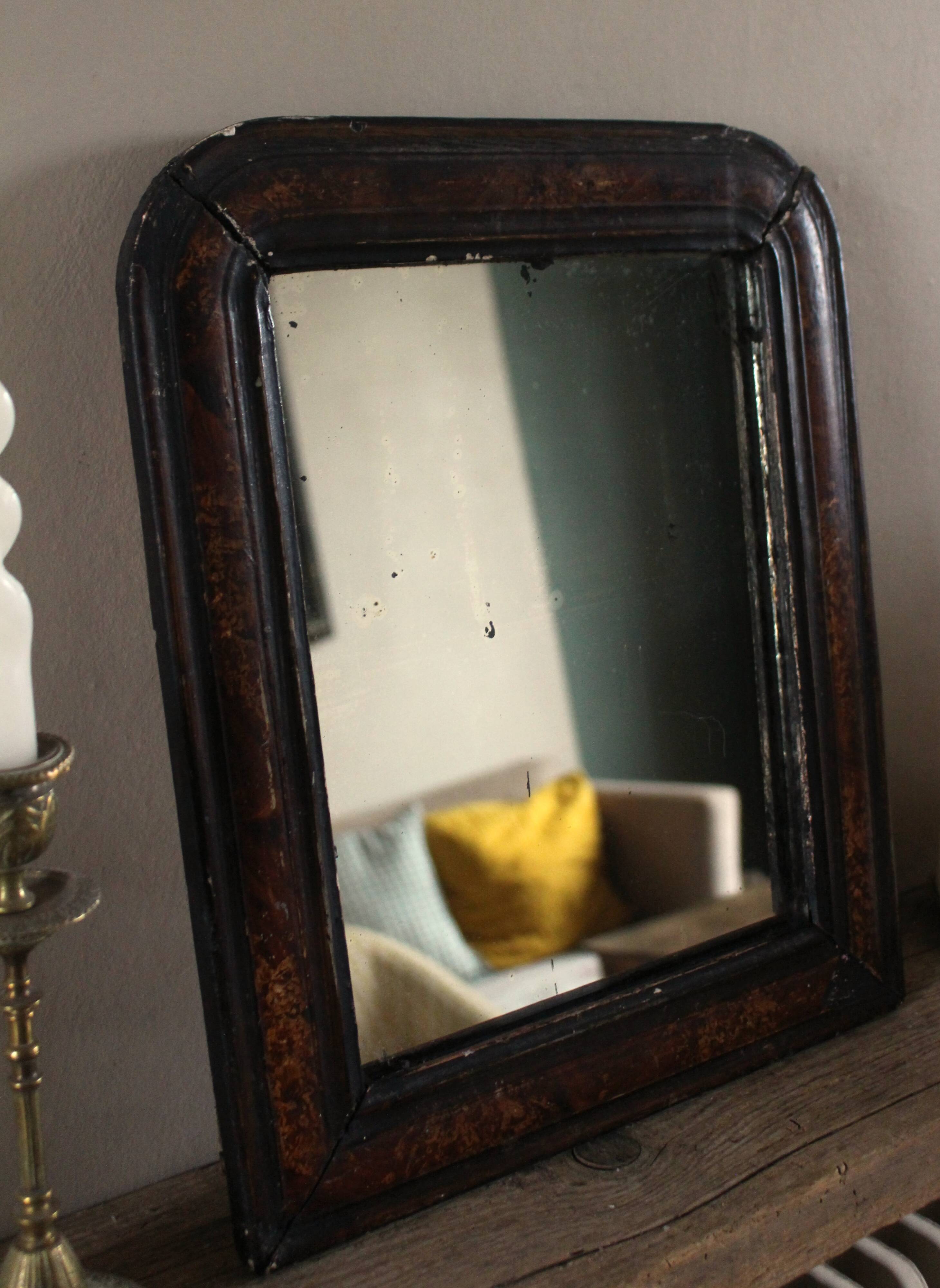 Antique Louis Philippe mirror in black and brown.